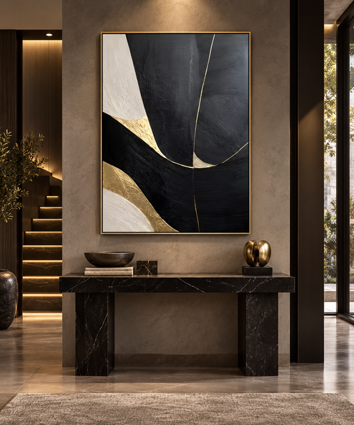NOCTARA black ivory beige and gold abstract wall art above a black stone console in a refined entryway