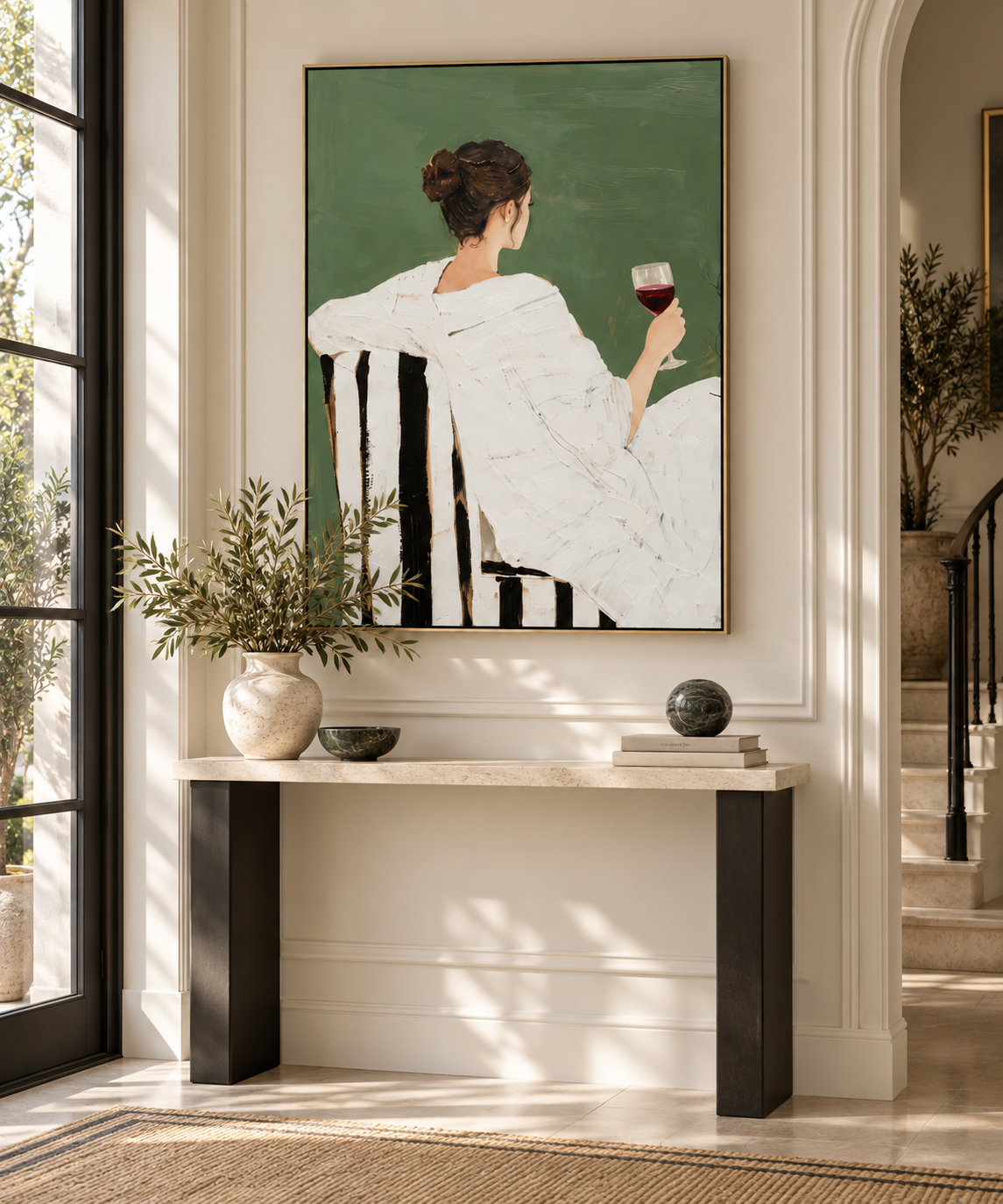 SORENA woman with wine painting above a console in an elegant entryway